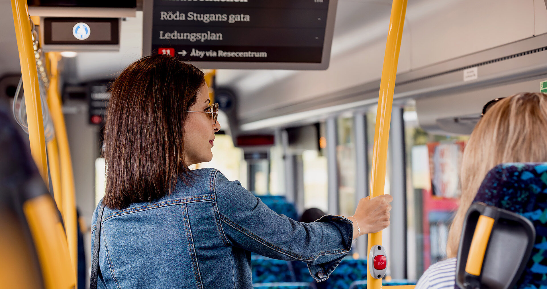 Passenger standing on a bus