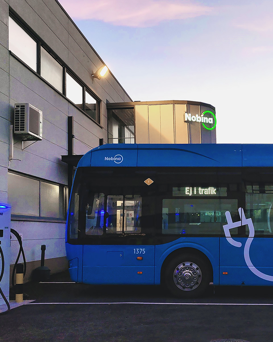 An electric bus with the logo "Nobina"